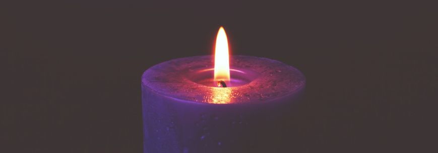 one purple advent candle lit